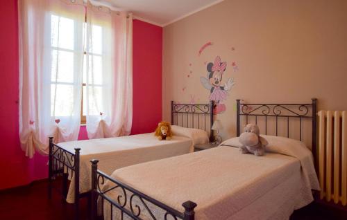 two beds in a bedroom with two teddy bears on them at Lovely Home In Camaiore With Wifi in Camaiore