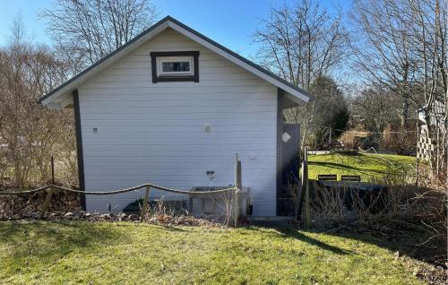 a white house with a window on the side of it at 2 Bedroom Cozy Home In Farhult in Farhult