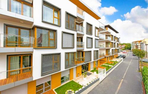 an apartment building with orange and white windows at 2 Bedroom Cozy Apartment In Hel in Hel