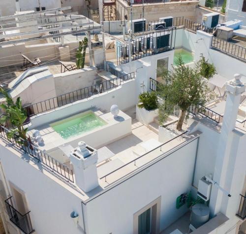 an aerial view of a building with a swimming pool at Dimore di Brando Vico Gelso in Polignano a Mare