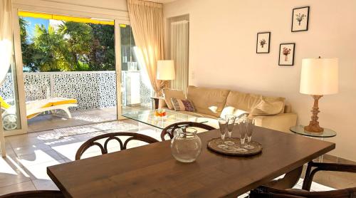 a living room with a table and a couch at Ascona Bellavista in Ascona