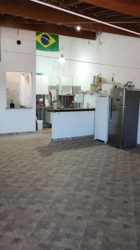 a large room with a kitchen with refrigerators in it at Pico do Jaraguá in São Paulo