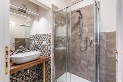 a bathroom with a sink and a shower at Futura Collection Florence City Center in Florence
