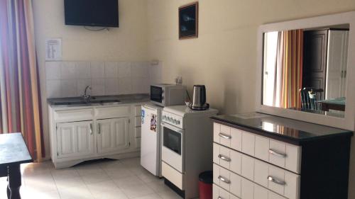 Kuchyň nebo kuchyňský kout v ubytování Mariblu Hotel