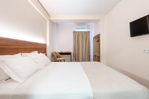 Katil atau katil-katil dalam bilik di Catolica Hotel