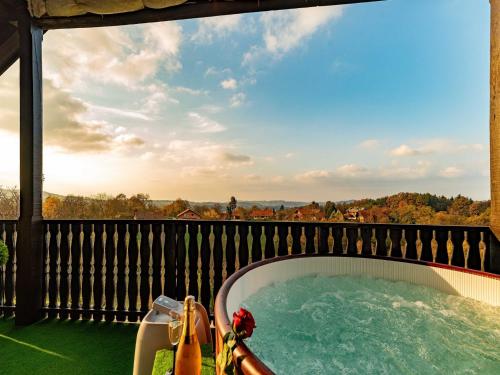 a hot tub on the deck of a house at San Vinogradara in Donja Stubica