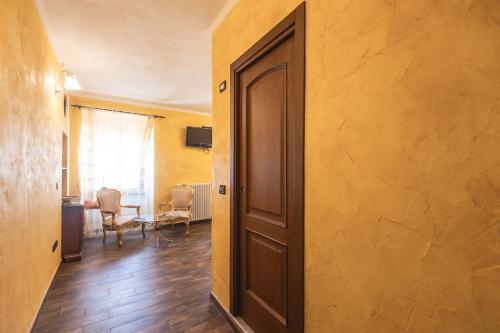 an open door to a room with a table at La Locanda dell'Ambra in Talamello