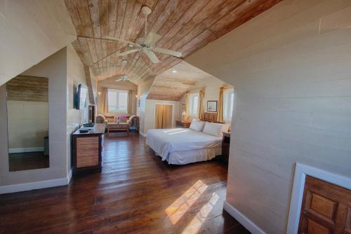 a bedroom with a bed and a ceiling fan at A Stone's Throw Away in Nassau