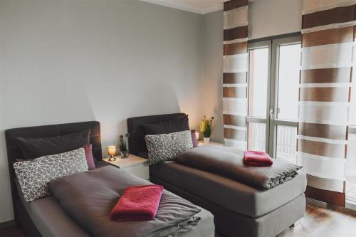 a living room with a couch and a window at Ferienwohnung Tretter Natur Pur in Erbendorf