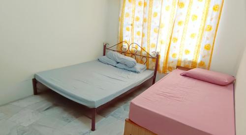 Postel nebo postele na pokoji v ubytování Pilah homestay
