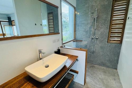 a bathroom with a sink and a shower at Private Garden Villa With Parking in Las Terrenas