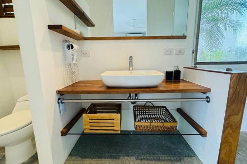 a bathroom with a sink and a toilet at Private Garden Villa With Parking in Las Terrenas