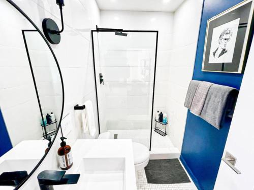 a bathroom with a white toilet and a shower at Cozy Studio Retreat with Shared Pool - MK4-WW in Los Angeles