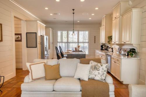 a living room with a couch and a kitchen at Southern Farm House 4 Br 4 Bath in Moultrie