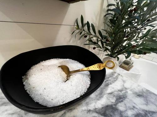 a bowl of white rice with a spoon on a counter at Southern Farm House 4 Br 4 Bath in Moultrie