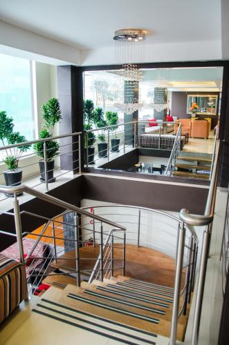 a spiral staircase in a building with a lobby at Hotel Britania Miraflores in Lima