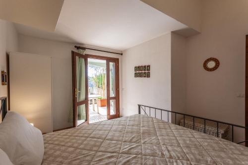 Ένα ή περισσότερα κρεβάτια σε δωμάτιο στο Sa Domo e Aurelia