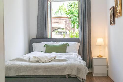 a bedroom with a bed with a window at Stunning 2BR Apartment Perfect for 4 people in Vienna