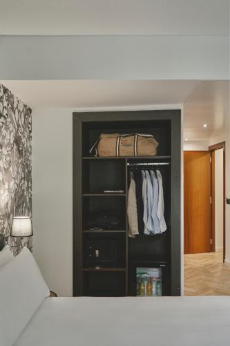 Postel nebo postele na pokoji v ubytování Oriente Atiram Hotel
