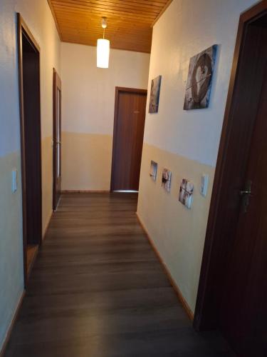 a hallway of an office with pictures on the wall at Einfaches Monteurszimmer für Langzeitaufenthalte in Goslar