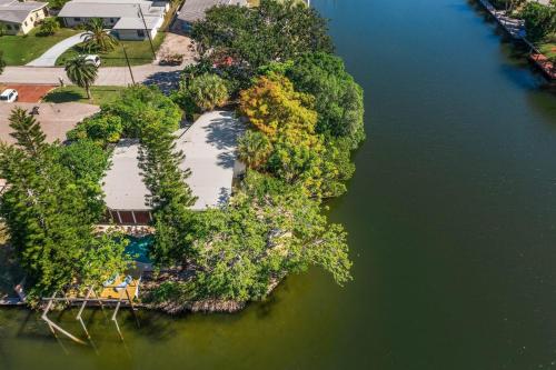 an aerial view of an island in the water at Coconut Cove - Heated Pool And Canal in Cocoa Beach