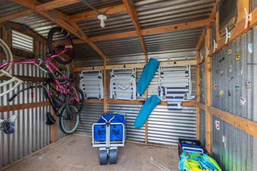 a room with a climbing gym with a bike at Surfs Up - Retreat At The Beach With Heated Pool in Melbourne Beach