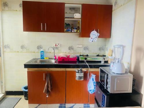 a kitchen with a counter with a blender on it at Paradise in Dar es Salaam