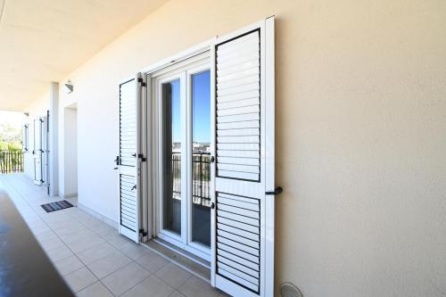 an open door with a view of a balcony at Le Case Di Nonna Angela in Matera