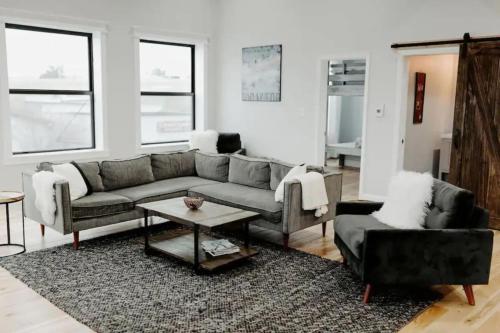 a living room with a couch and a table at Stadium Lofts on Meridian #1 in Indianapolis