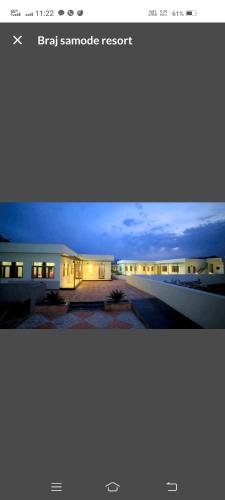 a view of a building at night with the lights on at Braj samode resort in Sāmod