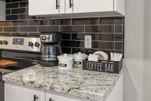 a kitchen counter with a coffee bar sign on it at Lakeside Bliss 2BR, 1BA with All Modern Comforts in Algonac