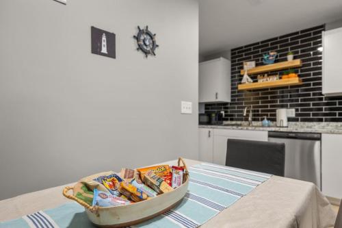 a kitchen with a table with a bowl of food on it at Lakeside Bliss 2BR, 1BA with All Modern Comforts in Algonac