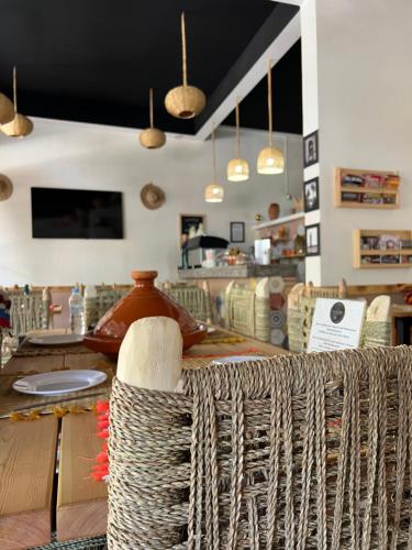 a store with a table with a basket on it at Tazart Lodge in Marrakech