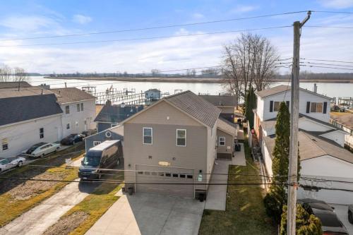 a train is parked in front of a house at Lakeside Bliss 2BR, 1BA with All Modern Comforts in Algonac