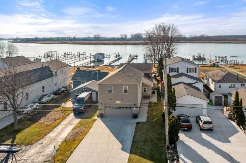 arial view of a residential neighborhood with a body of water at Lakeside Bliss 2BR, 1BA with All Modern Comforts in Algonac