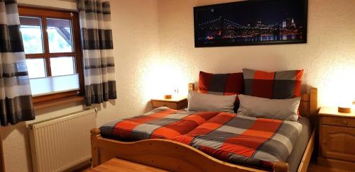 Кровать или кровати в номере Ferienhaus Breit
