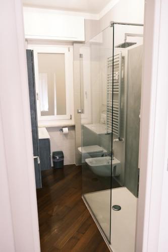 a bathroom with a glass shower and a toilet at Elegant Apartment in Santa by PortofinoVacanze in Santa Margherita Ligure
