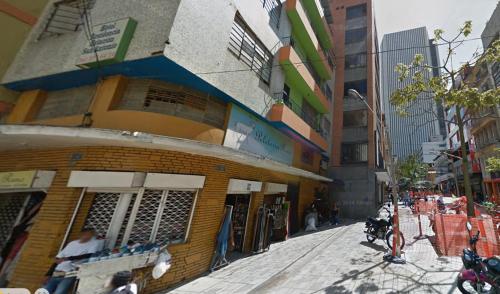 a building on the side of a city street at Hotel Estacion San Antonio in Medellín