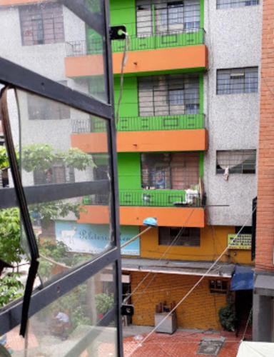 a view of an apartment building from a window at Hotel Estacion San Antonio in Medellín
