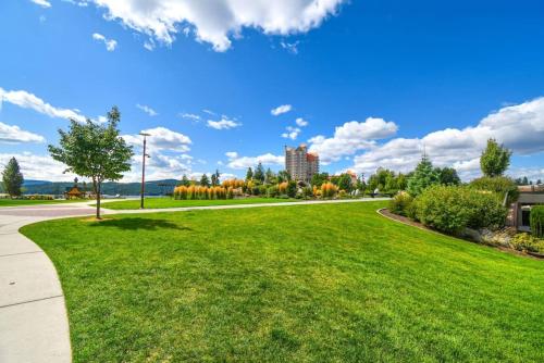 a park with green grass and a road at Tranquility Base - Family Fun Modern Farm House in Dalton Gardens