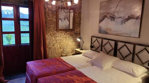 A bed or beds in a room at Casa Rural del General Albelda