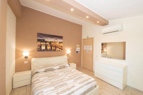 Un pat sau paturi într-o cameră la Le Ghiande Guest House