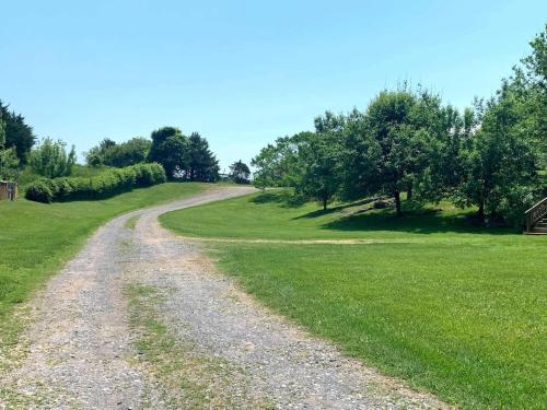 a dirt road in the middle of a field at Heartstone Country Retreat in Buena Vista