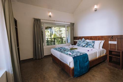 Postel nebo postele na pokoji v ubytování Elixir Woods Luxury Resort And Spa, Munnar