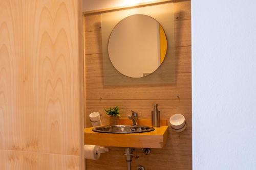 a bathroom with a sink and a mirror at La Casetta sul mare in Castellammare del Golfo