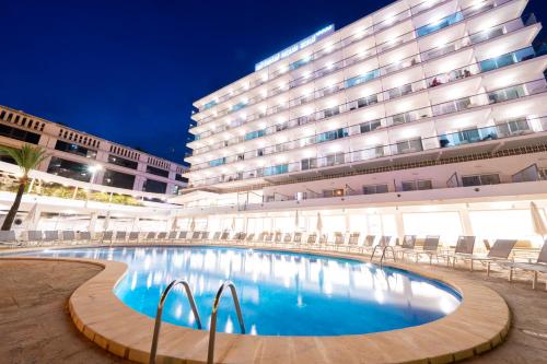 a swimming pool in front of a hotel at Hotel Agua Azul - Adults Only in Benidorm