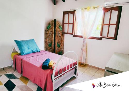 Кровать или кровати в номере Villa Bom Siwo: Anse Bertrand