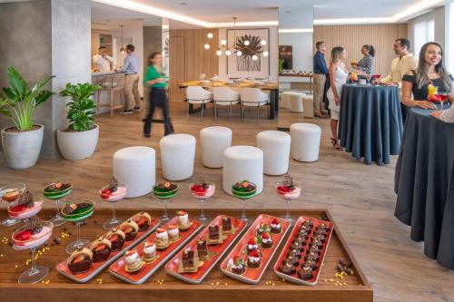 a buffet of food on a table in a room at Serhs Natal Grand Hotel & Resort in Natal