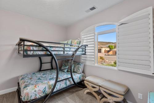 a room with two bunk beds and a window at Sand Hollow 3334 BBQ Grill, Private Splash Pad, Hot tub and Pool in Hurricane