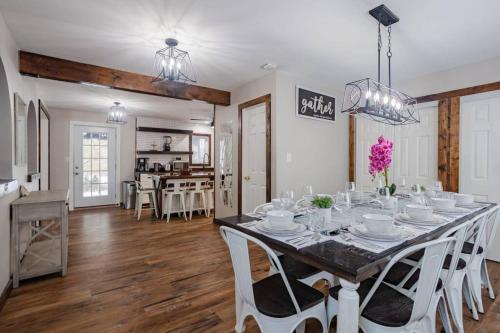 a dining room and kitchen with a table and chairs at Pocono Retreat Movies Games Spacious in Long Pond